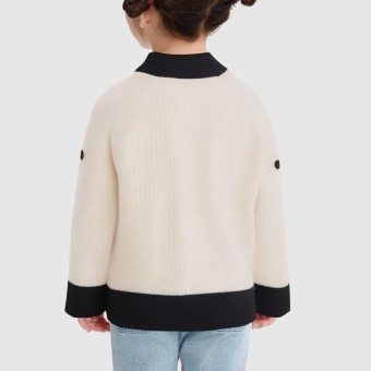 Knitted sweater decorated with colorful pom-poms